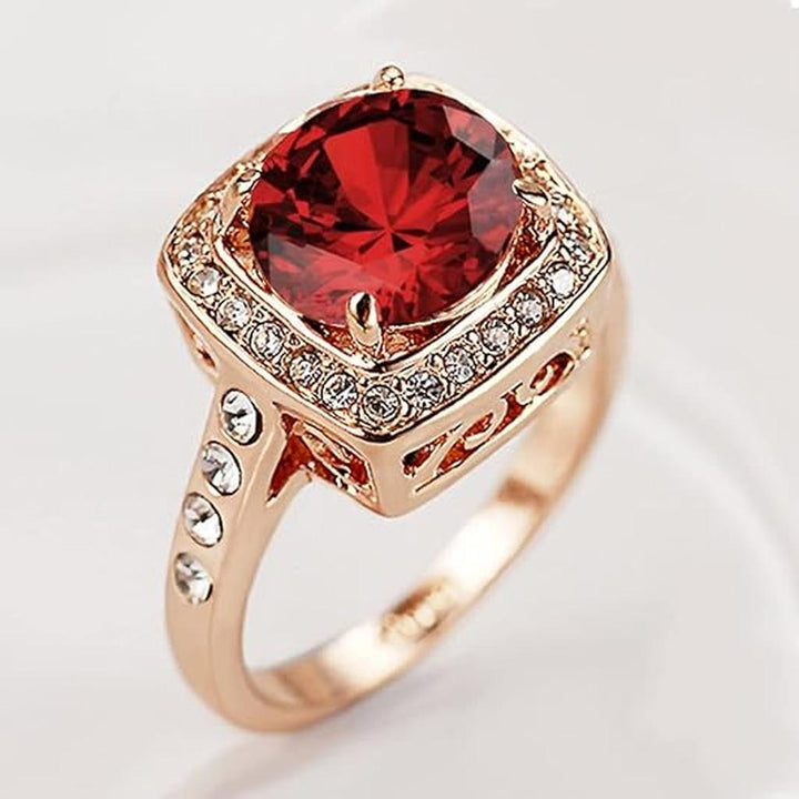 Anillo rojo rubí con corona · Rosado