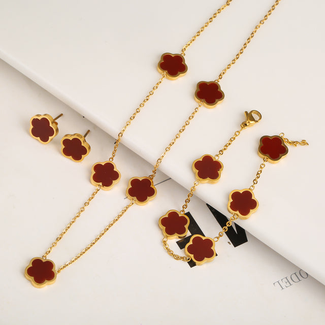 Set de pulsera, collar y pendientes de trébol · Dorado