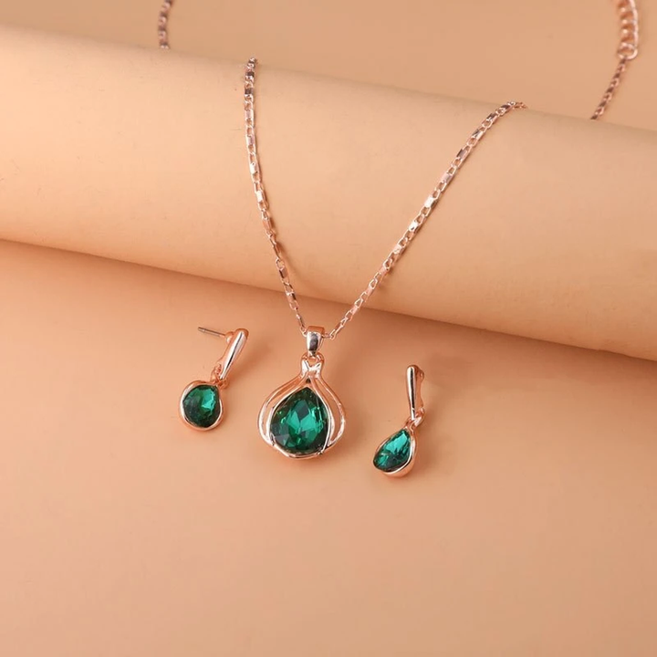 Conjunto de collar y pendientes con cristal verde · Dorado