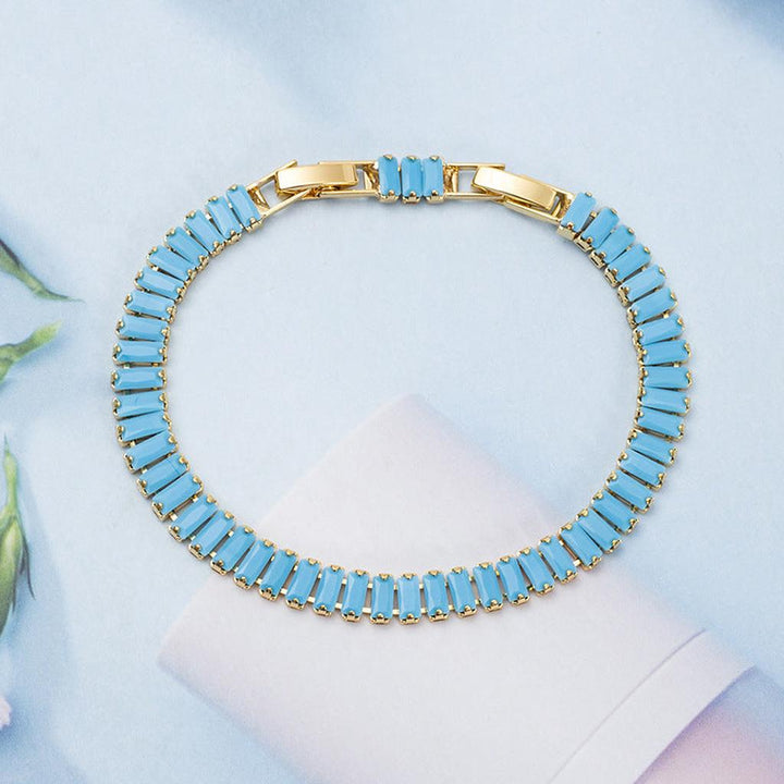Pulsera tenis Vertéa turquesa · Dorado