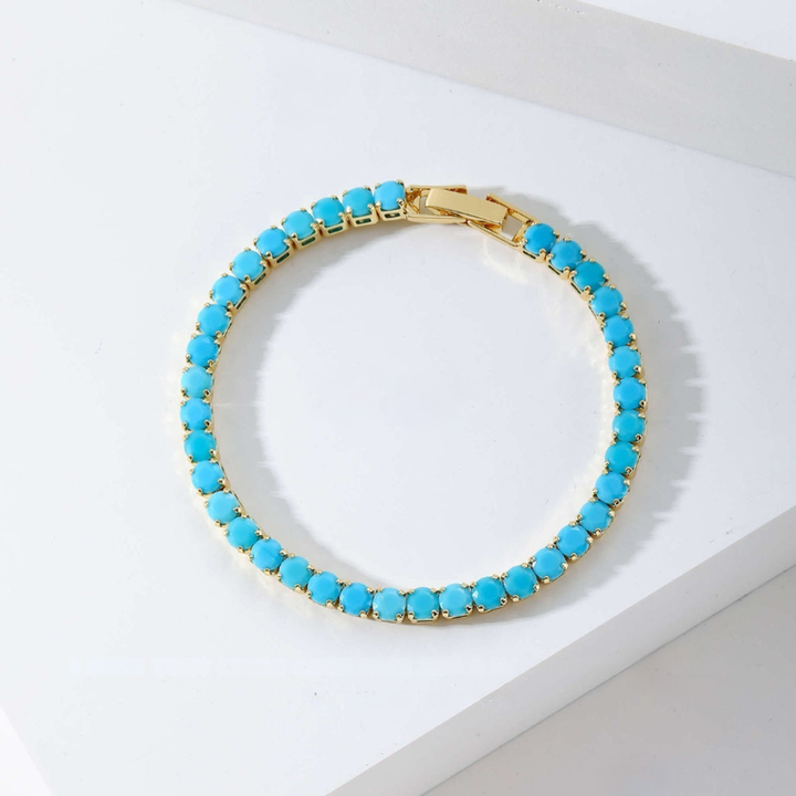 Pulsera tenis redonda turquesa · Dorado