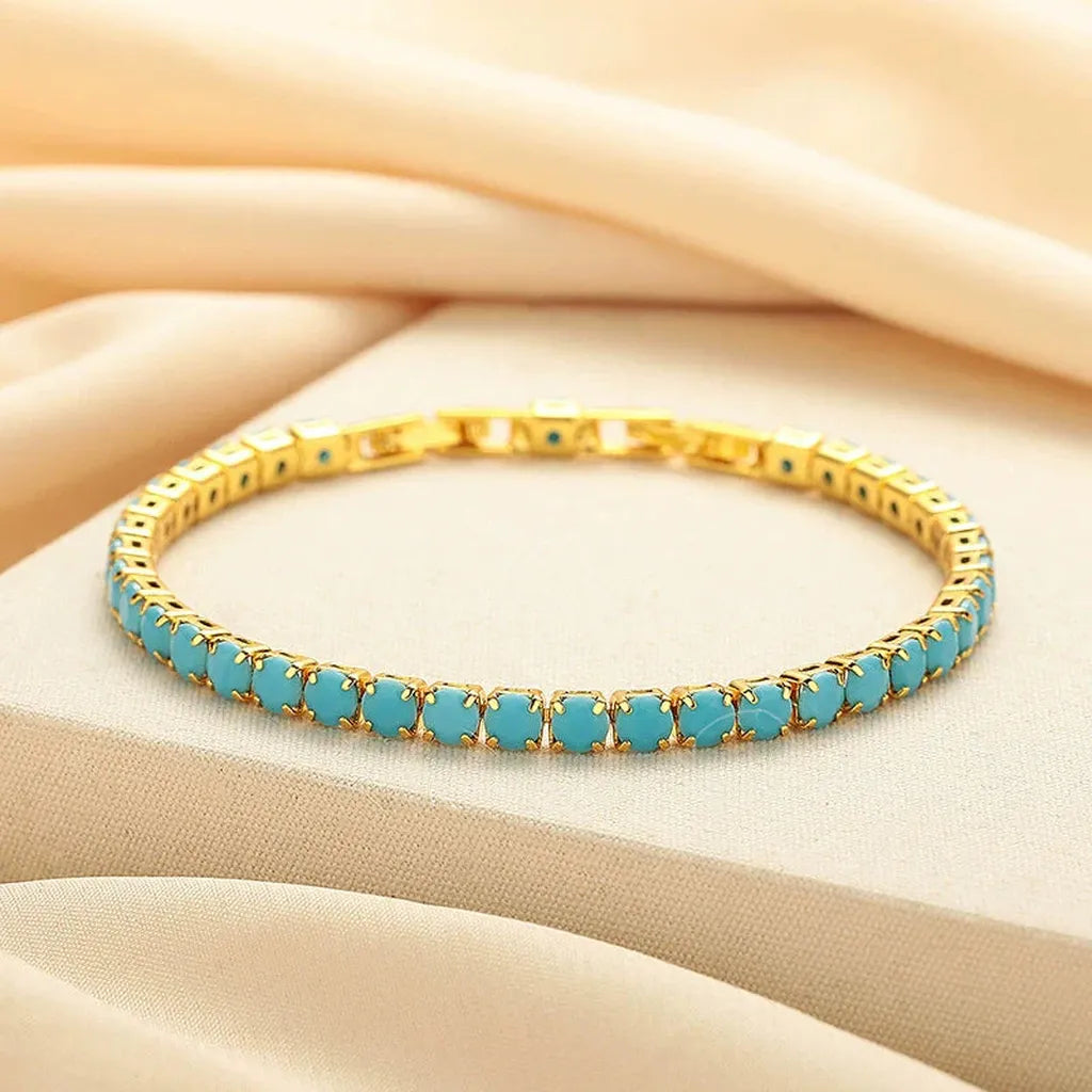 Pulsera tenis redonda turquesa · Dorado
