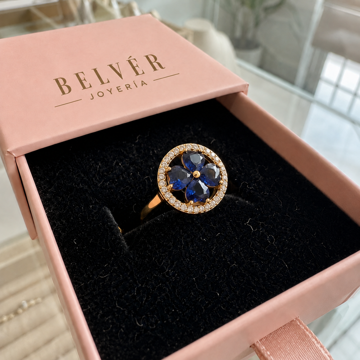 Anillo giratorio de corazones azul zafiro · Dorado