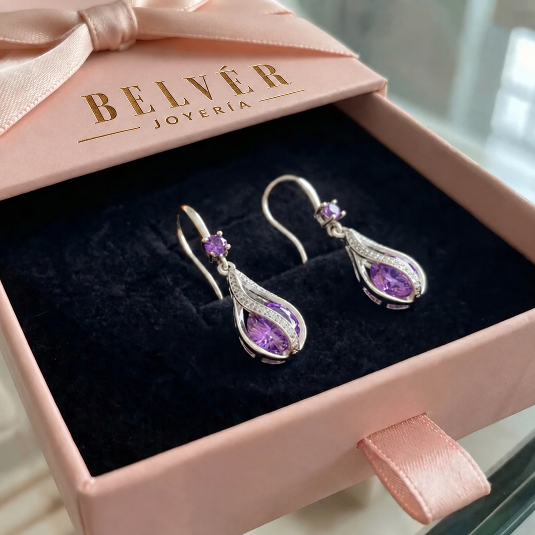 Pendientes Calithra Lumen con giro · Plateado