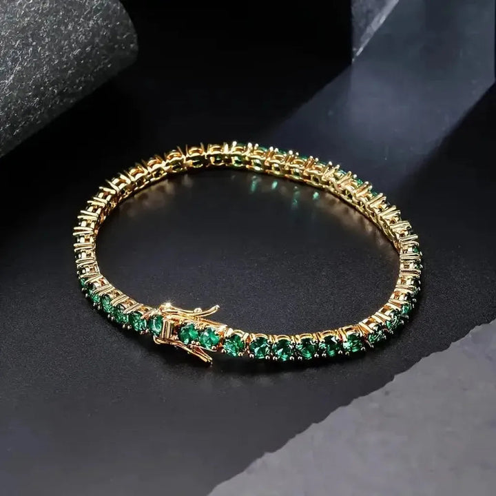 Pulsera tenis con detalles verde esmeralda · Dorado
